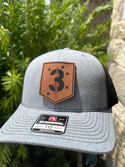 a close up of a hat with a patch on it