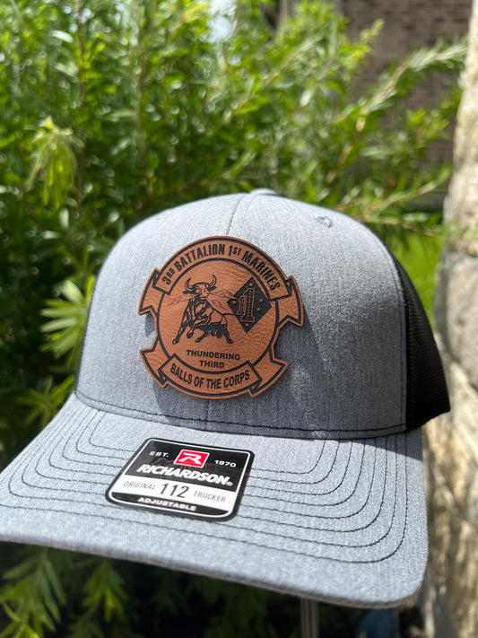 a close up of a hat with a patch on it